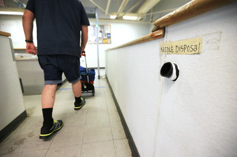A worker pushes tools through a metal detector at the Road Home in Salt Lake City on Wednesday, July 11, 2018. The shelter has created a new security screening area in the men's section.