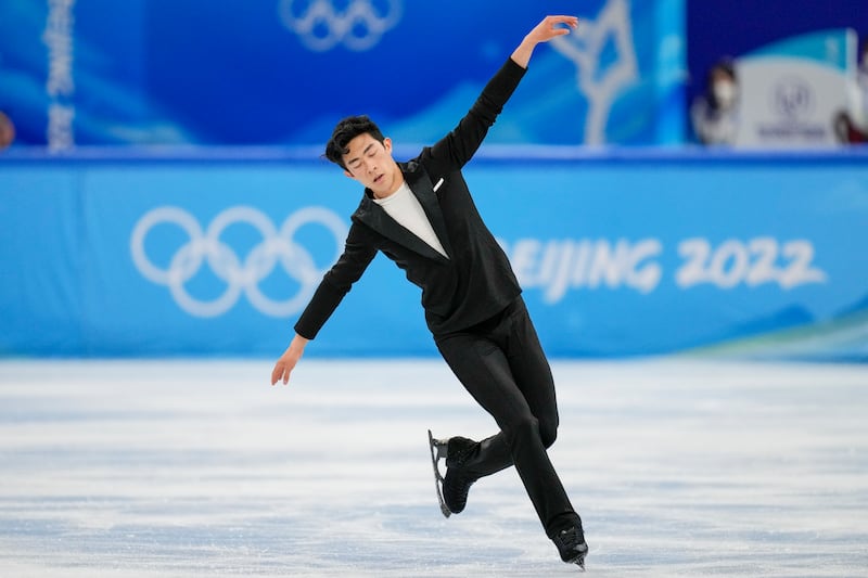 Nathan Chen, of the United States, competes during the men’s singles short program team event in the figure skating competition at the 2022 Winter Olympics in Beijing.