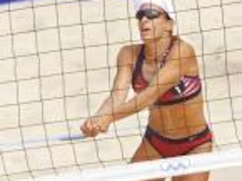 Holly McPeak of the U.S. team bumps the ball in a 15-5 beach volleyball victory over the Czech team on Saturday.