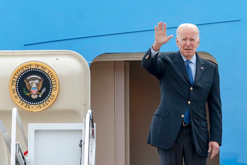 President Joe Biden waves as he boards Air Force One at Andrews Air Force Base, Maryland.