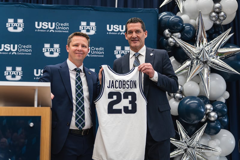 Utah State athletic director Cam Walker introduces new men's basketball coach Ben Jacobson at a press conference in Logan Tuesday, March 21, 2026.