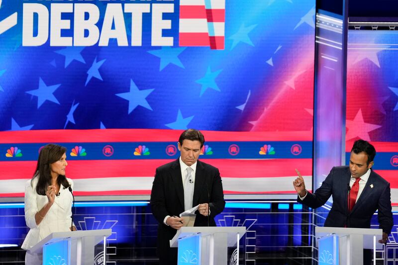 Republican presidential candidates, from left, Nikki Haley, Ron DeSantis and Vivek Ramaswamy participate in a Republican presidential primary debate on Nov. 8, 2023, in Miami.