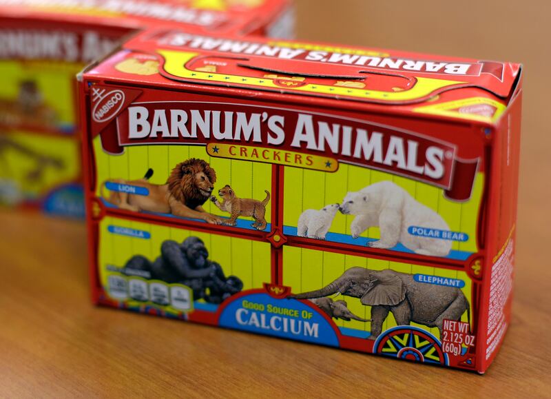 This photo shows Nabisco Barnum's Animals crackers on the shelf of a grocery store in Des Moines, Iowa. After more than a century behind bars, the beasts on boxes of animal crackers are roaming free. The new boxes retain their familiar red and yellow colo