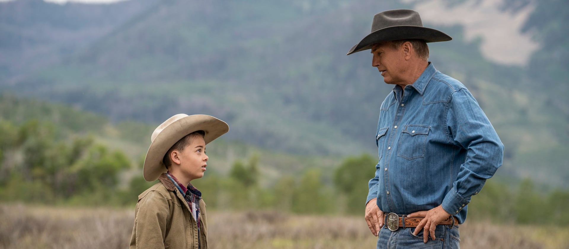 Brecken Merrill as Tate Dutton and Kevin Costner as John Dutton in an episode of “Yellowstone.”