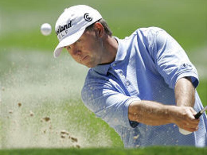 Cameron Beckman blasts out of the bunker during the second round of the International on Saturday.