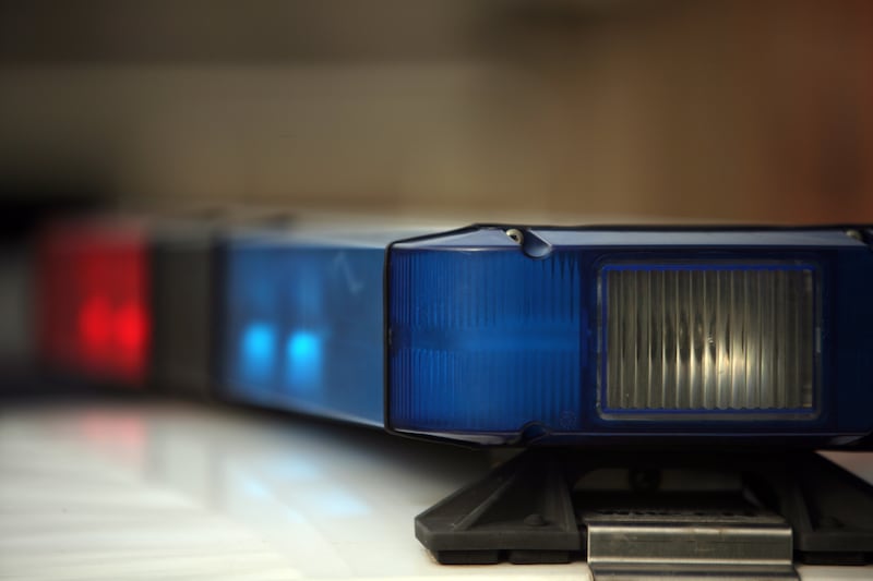 A police office who was hit by a vehicle Tuesday night has minor injuries as the search for one suspect continues.