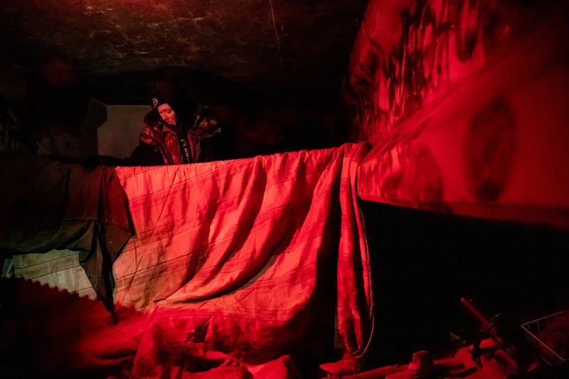 Marie VanValkenburg, left, and Nathen Brown, out of view, answer survey questions for the annual Point-in-Time count a camp they have been staying at under a bridge along the Jordan River in South Salt Lake on Thursday, Jan. 24, 2019.