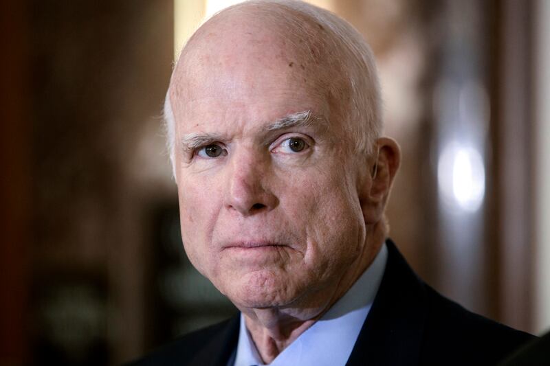 FILE - In this Oct. 25, 2017 file photo, Senate Armed Services Chairman John McCain, R-Ariz., pauses before speaking to reporters during a meeting of the National Defense Authorization Act conferees, on Capitol Hill in Washington.