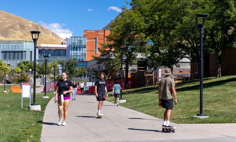 Students walk on the University of Utah campus in Salt Lake City.
