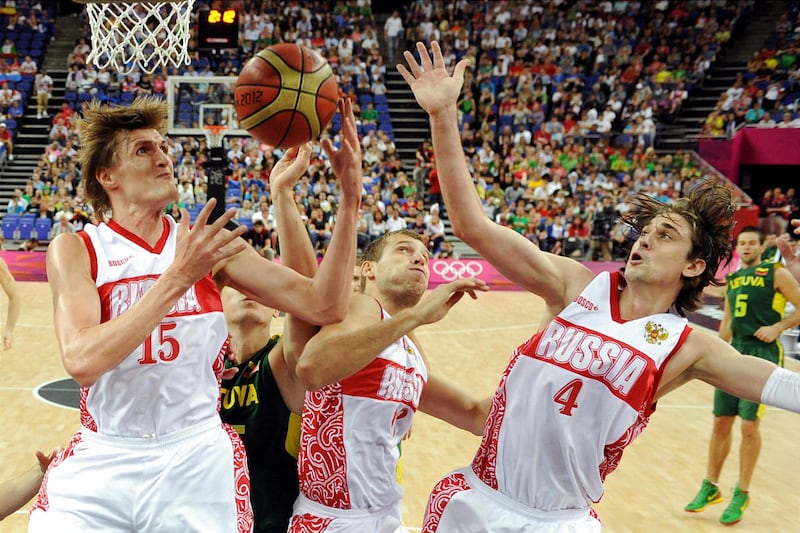 FILE - This Aug. 8, 2012 file photo shows Russian forwards Andrei Kirilenko, left, Sergey Monya, center, and guard Alexey Shved, right, during a men's quarterfinal basketball game at the 2012 Summer Olympics in London. Kirilenko and Shved have enjoyed the