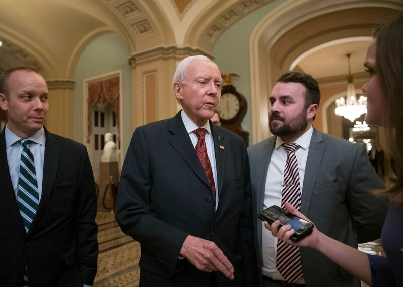 Senate Finance Committee Chairman Orrin Hatch, R-Utah, walks to the chamber as Republicans in the House and Senate plan to pass the sweeping $1.5 trillion GOP tax bill on party-line votes, at the Capitol in Washington, Monday, Dec. 18, 2017. Utah's four U