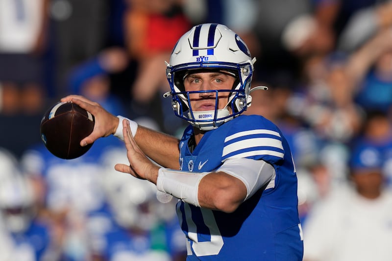 BYU quarterback Kedon Slovis throws for a touchdown during game against Texas Tech Saturday, Oct. 21, 2023, in Provo, Utah.