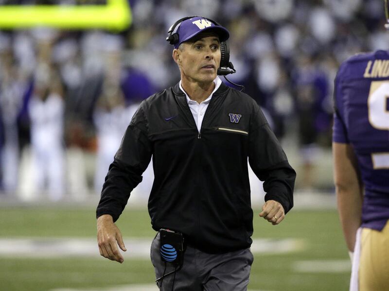 Washington head coach Chris Petersen directs his team against Oregon State in an NCAA college football game Saturday, Oct. 22, 2016, in Seattle. Washington won 41-17. (AP Photo/Elaine Thompson)