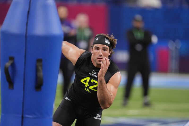 BYU defensive lineman Tyler Batty runs a drill at the NFL combine in Indianapolis, Thursday, Feb. 27, 2025. The former BYU standout is hoping to hear his name called during this week's NFL draft.
