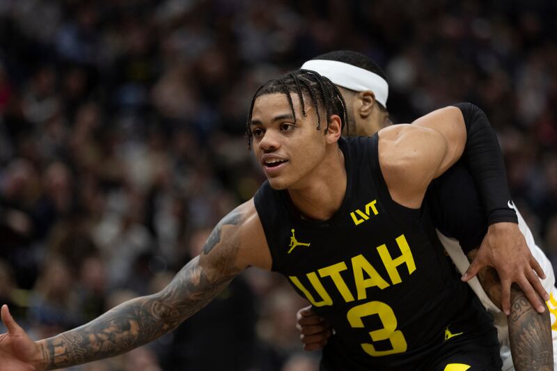 Utah Jazz guard Keyonte George (3) posts up against Golden State Warriors guard Gary Payton II (0) during a game at the Delta Center in Salt Lake City on Monday, Feb. 12, 2024.