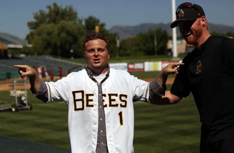 Patrick Renna, who played Ham in the movie “Sandlot,” jokes around with Bees players at Spring Mobile Ballpark in Salt Lake City on Friday, July 19, 2013.