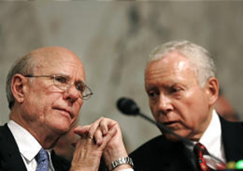 Senate Intelligence Committee Chairman Pat Roberts, R- Kan., left, talks with Sen. Orrin Hatch, R-Utah, during the confirmation hearing for President Bush's CIA nominee, Air Force Gen. Michael Hayden, on Thursday in Washington.