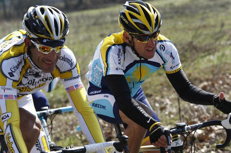 FILE - This March 21, 2009 file photo shows Lance Armstrong, of the United States, beside fellow countryman George Hincapie, left, during the Milan-San Remo cycling classic in San Remo, Italy. The U.S. Anti-Doping Agency says 11 of Lance Armstrong's forme