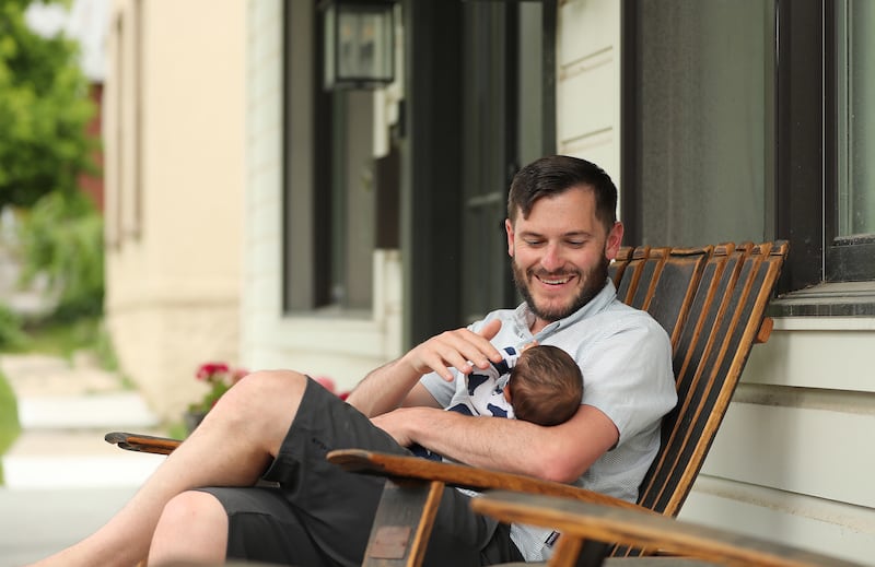 Dr. Adam Bress holds his 8-week-old son, Devan, at their home in Salt Lake City, Utah, on Wednesday, June 12, 2019.