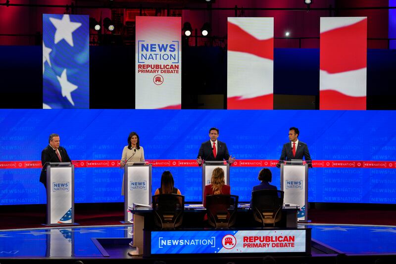 Florida Gov. Ron DeSantis speaks as former New Jersey Gov. Chris Christie, former U.N. Ambassador Nikki Haley and businessman Vivek Ramaswamy watch during a Republican presidential primary debate.