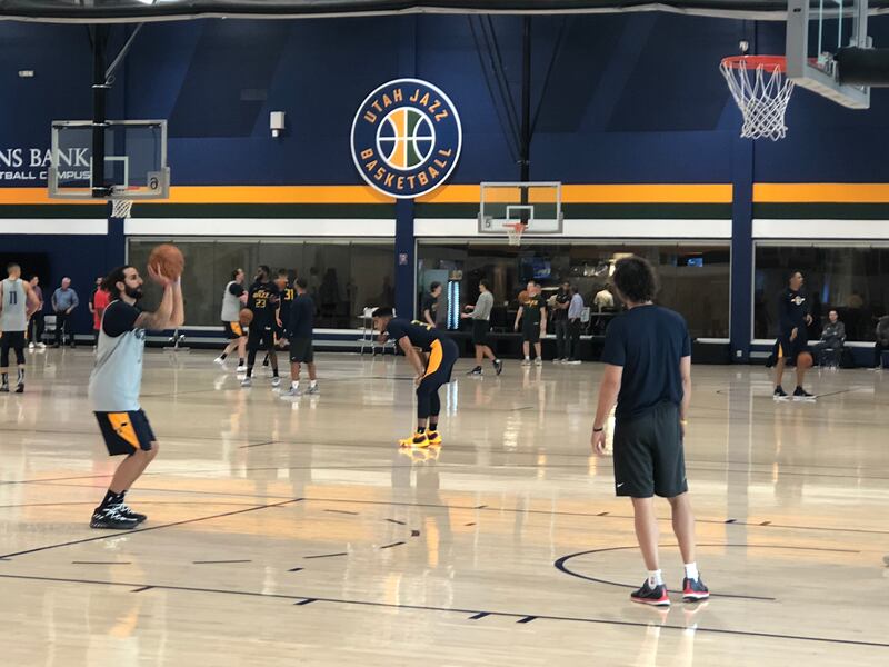 Ricky Rubio (left) takes a free throw on the first day of training camp on Tuesday, Sept. 25, 2018, while former Utah Jazz point guard Raul Lopez (right) watches his form from underneath the rim. Lopez has joined the Jazz coaching staff for this season.