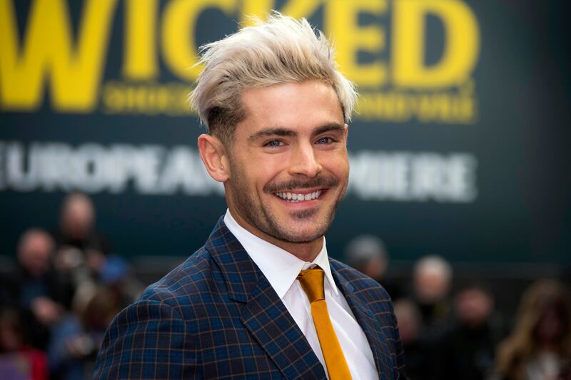 Actor Zac Efron poses for photographers upon arrival at a premiere in London.