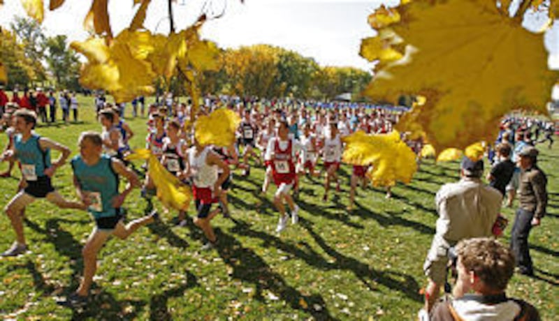 Lloyd Newell, the voice of "Music and the Spoken Word," went back to Sharon Elementary in Orem, which he attended as a boy, and received the "Soaring Eagle" award. His son McKay, 4, stands beside his dad.