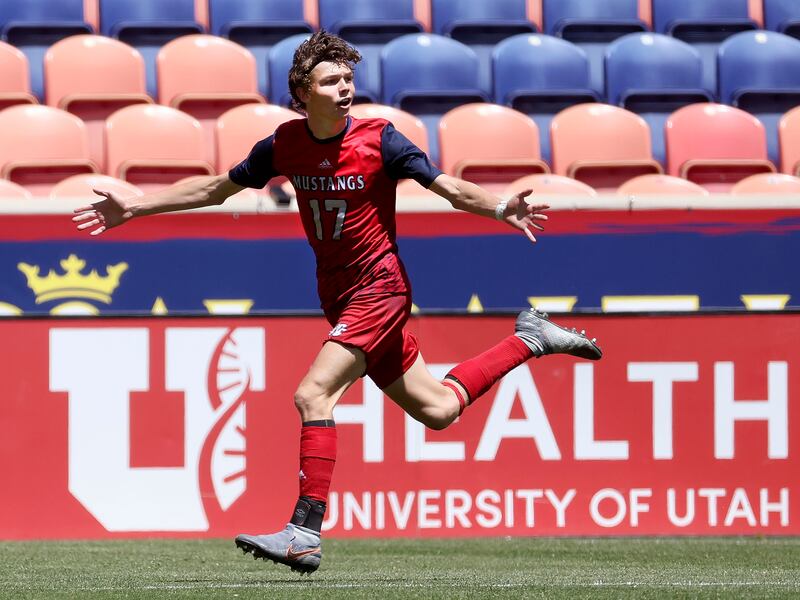 Crimson Cliffs’ Ryan Woolley celebrates his goal against Ridgeline in the 4A boys soccer championship game.