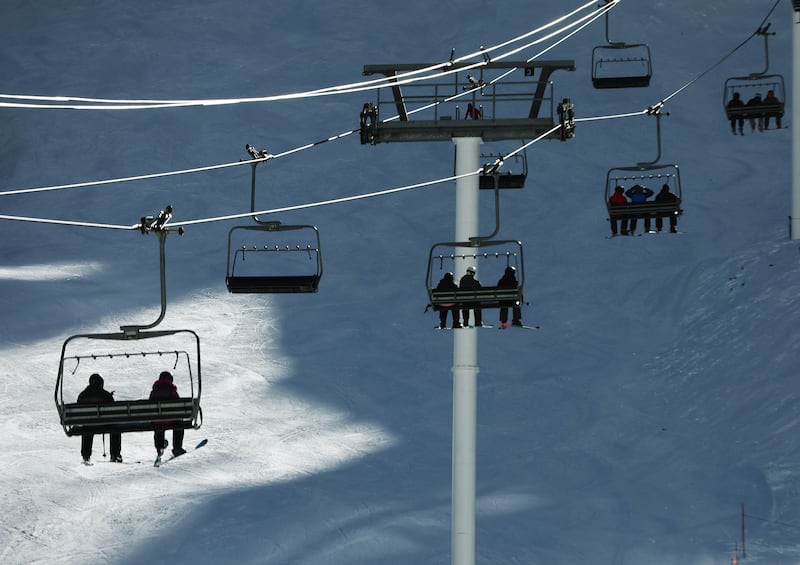 Skiers ride the lift at Alta Ski Resort on Friday, Dec. 15, 2023.