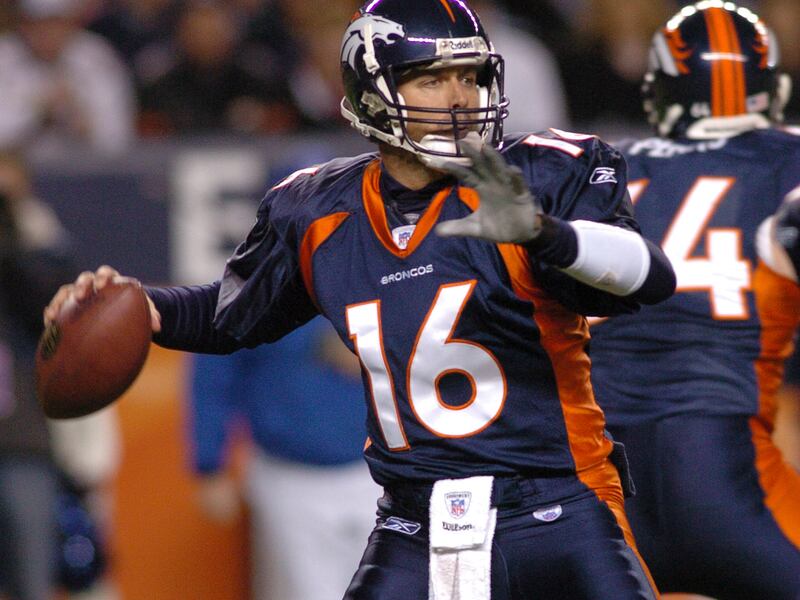 Denver Broncos quarterback Jake Plummer winds up to throw a pass during the first quarter of an NFL football game against the San Diego Chargers, Sunday, Nov. 19, 2006, in Denver. (AP Photo/Bill Ross)