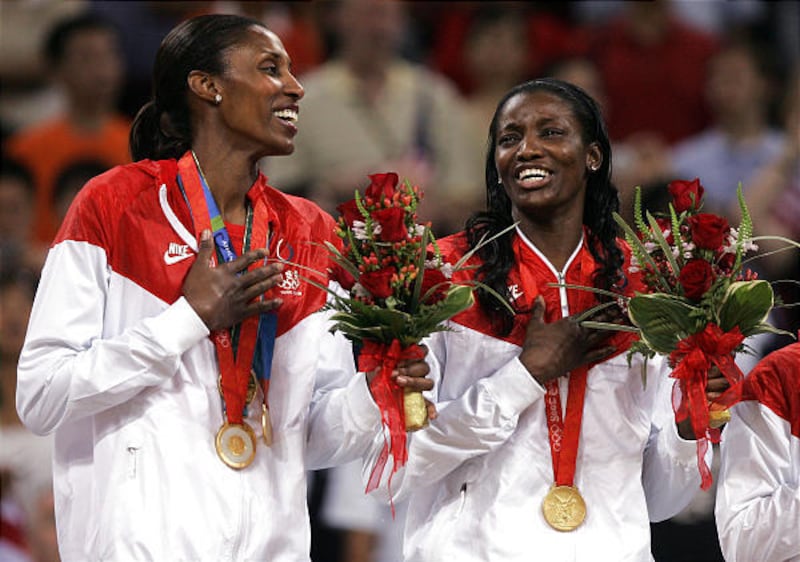 Lisa Leslie, left, and Delisha Milton-Jones celebrate after winning the gold medal against Australia at the Beijing Olympic Basketball Gymnasium Saturday.