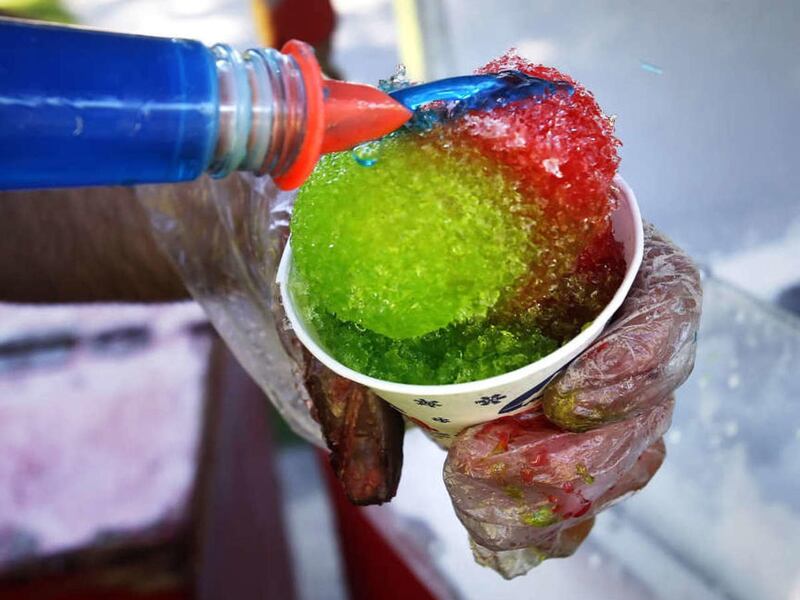 This 2011 file photo shows a snow cone being made in Salt Lake City. The first day of spring in Utah brought temperatures in the high 60s and sunshine. For a Tooele man, it brought an unusually early opening day for his snow cone stand.