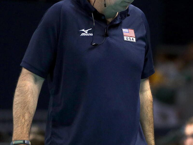 In this photo made Friday, Aug. 3, 2012, Hugh McCutcheon, coach of the United States women's volleyball team, stands on the sidelines during a match against Serbia at the 2012 Summer Olympics in London. Next up for McCutcheon and the team is the gold-meda