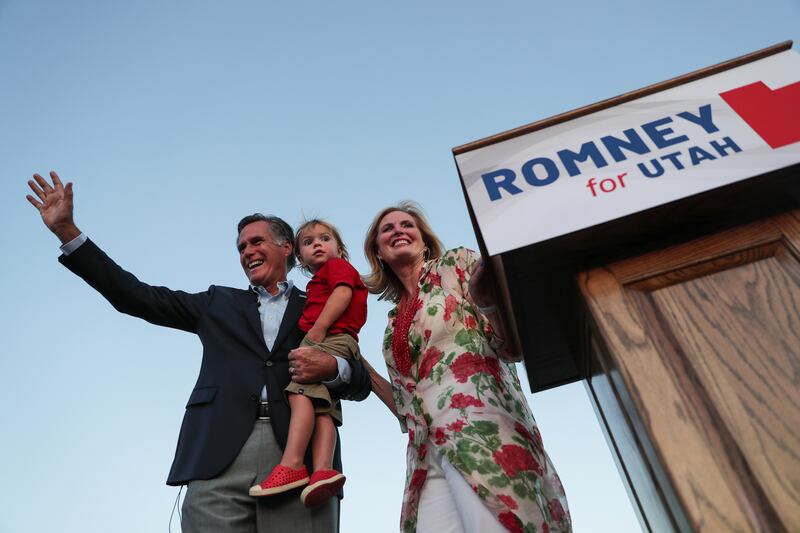 Mitt Romney, wife Ann and their youngest grandson, Dane, wave to the crowd as Mitt Romney claims victory in the Republican primary for U.S. Senate