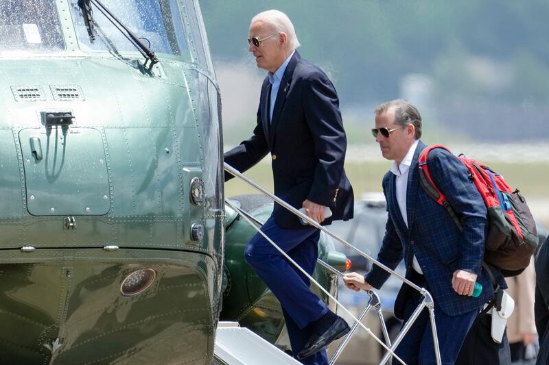 President Joe Biden boards Marine One with his son Hunter Biden.