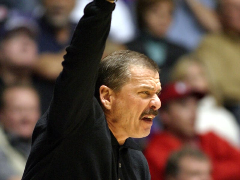 \Weber State head coach Joe Cravens gestures to his team against the University of Utah during the second half of play at the Dee Events Center in Ogden.