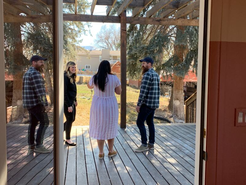 Designer Candis Meredith, homeowner Aubrey Bennion and Andy Meredith at Bennion’s home in Bountiful.