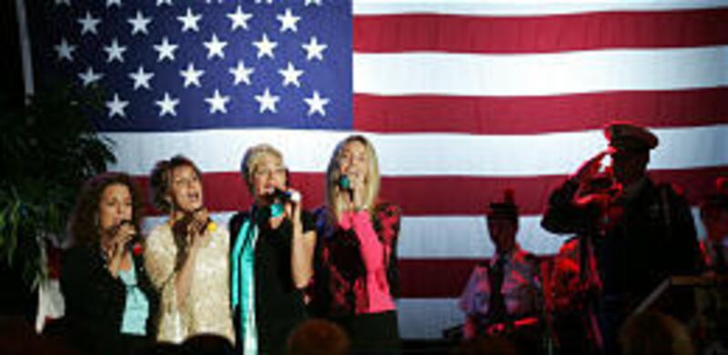 Kelly Shepardson, left, Katharine Adams, Camille Aagard and Kerilyn Johnson, known as Providence, sing the national anthem at gala.