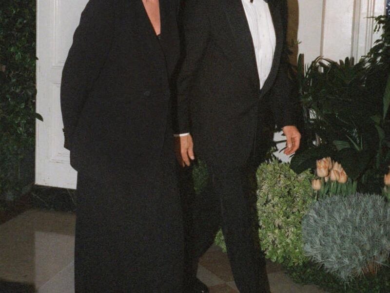 FILE - In this Feb. 5, 1998 file photo, Harrison Ford and his wife Melissa Mathison arrive at the White House for an official dinner for the British Prime Minister hosted by President Clinton in Washington. Mathison, the screenwriter who crafted the encha