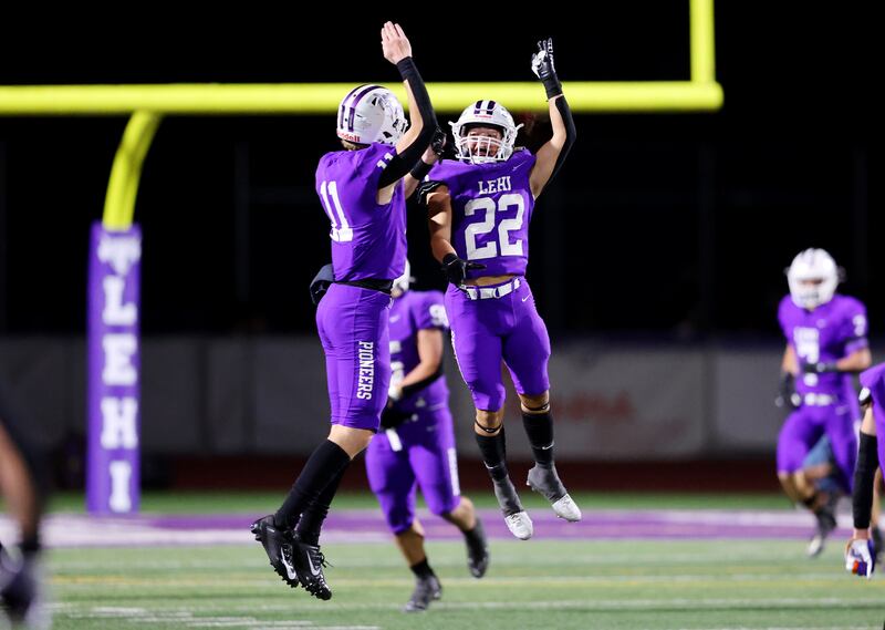 Lehi’s Kaleb Moore and Boston Fabrizio celebrates a Pioneer fumble recovery as they and Herriman play at Lehi on Friday, Sept. 8, 2023. Lehi won 48-28.