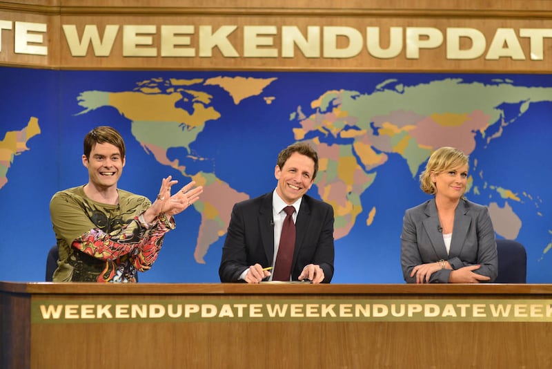 In this May 18, 2013 photo released by NBC, from left, Bill Hader, Seth Meyers, Amy Poehler appear in the "Weekend Update" skit on an episode of "Saturday Night Live," in New York.