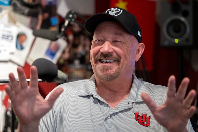 Radio personality Tim Hughes laughs during an interview with Lee Benson at his home studio in West Jordan on Oct. 26, 2021.