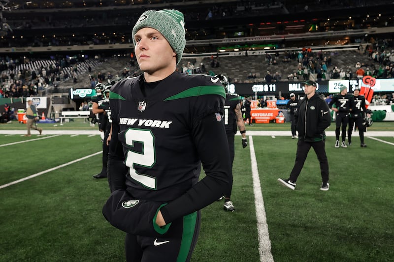 New York Jets quarterback Zach Wilson (2) walks off the field after an NFL football game against the Miami Dolphins, Friday, Nov. 24, 2023.