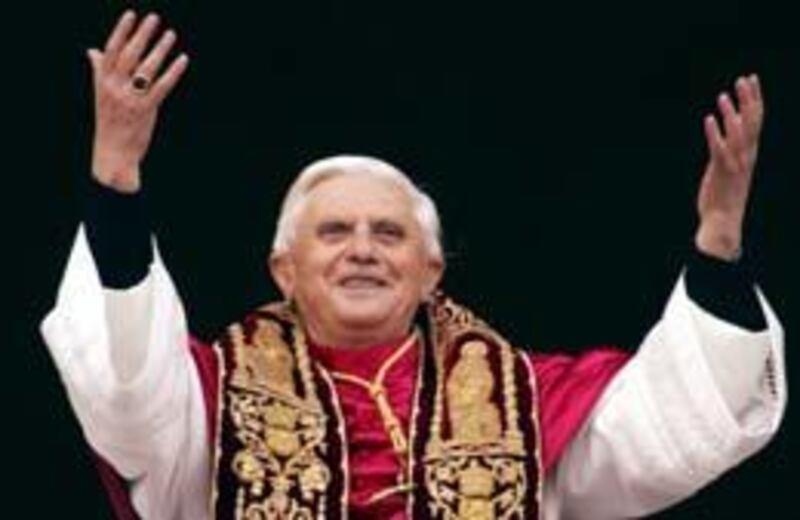 The newly elected Pope, Joseph Ratzinger of Germany, waves to the crowd from the central balcony of St. Peter's Basilica at the Vatican, Tuesday. Ratzinger is the 265th pontiff of the Roman Catholic Church.