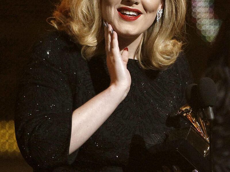 Adele accepts the award for best pop solo performance for "Someone Like You" during the 54th annual Grammy Awards on Sunday, Feb. 12, 2012 in Los Angeles.