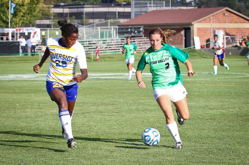 Utah Valley freshman defender Sara Callister (right) dribbles the ball around a UC Riverside defender Friday at Clyde Field.