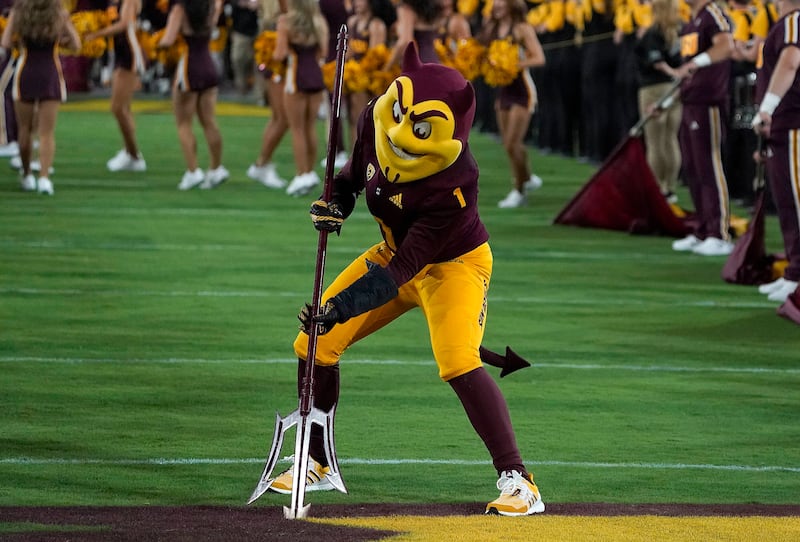 Arizona State’s mascot Sparky sticks a pitchfork into Sun Devil Stadium before a game on Sept. 17, 2022, in Tempe, Ariz.