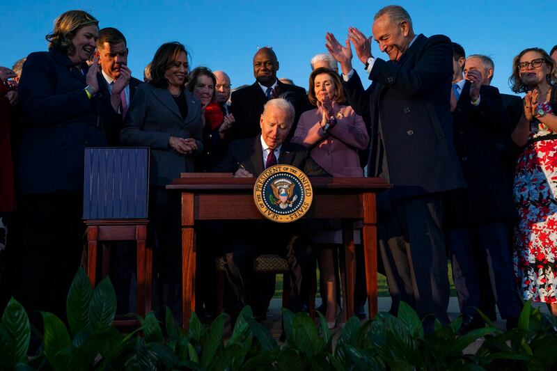 President Joe Biden signs the Infrastructure Investment and Jobs Act.