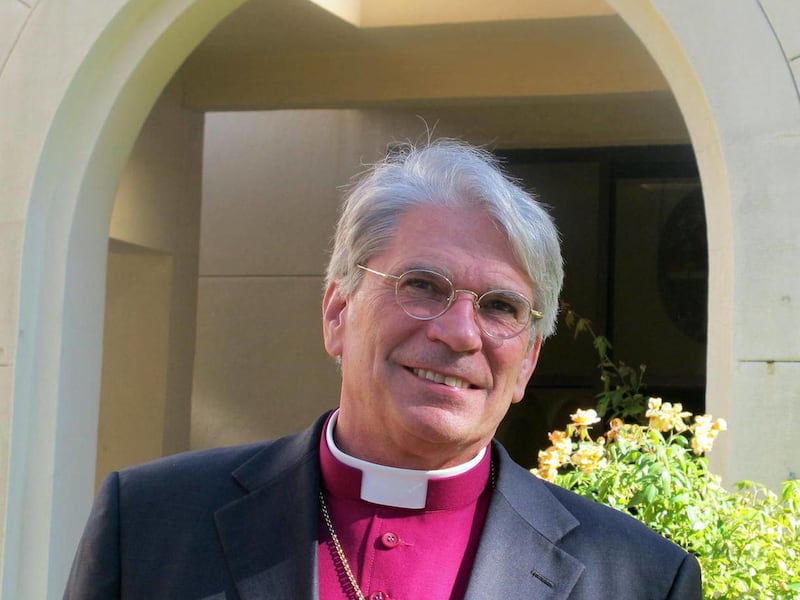 FILE - This Nov. 14, 2011 photo shows Bishop Mark Lawrence of the Diocese of South Carolina standing outside the Diocesan House in Charleston, S.C. The national Episcopal Church informed Lawrence this week that it has determined he has abandoned the churc
