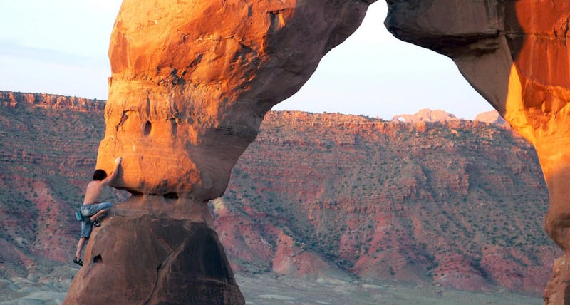 This image provided by Dean Potter shows Dean Potter climbing Delicate Arch, May 7, 2006 inside Arches National Park in Utah.